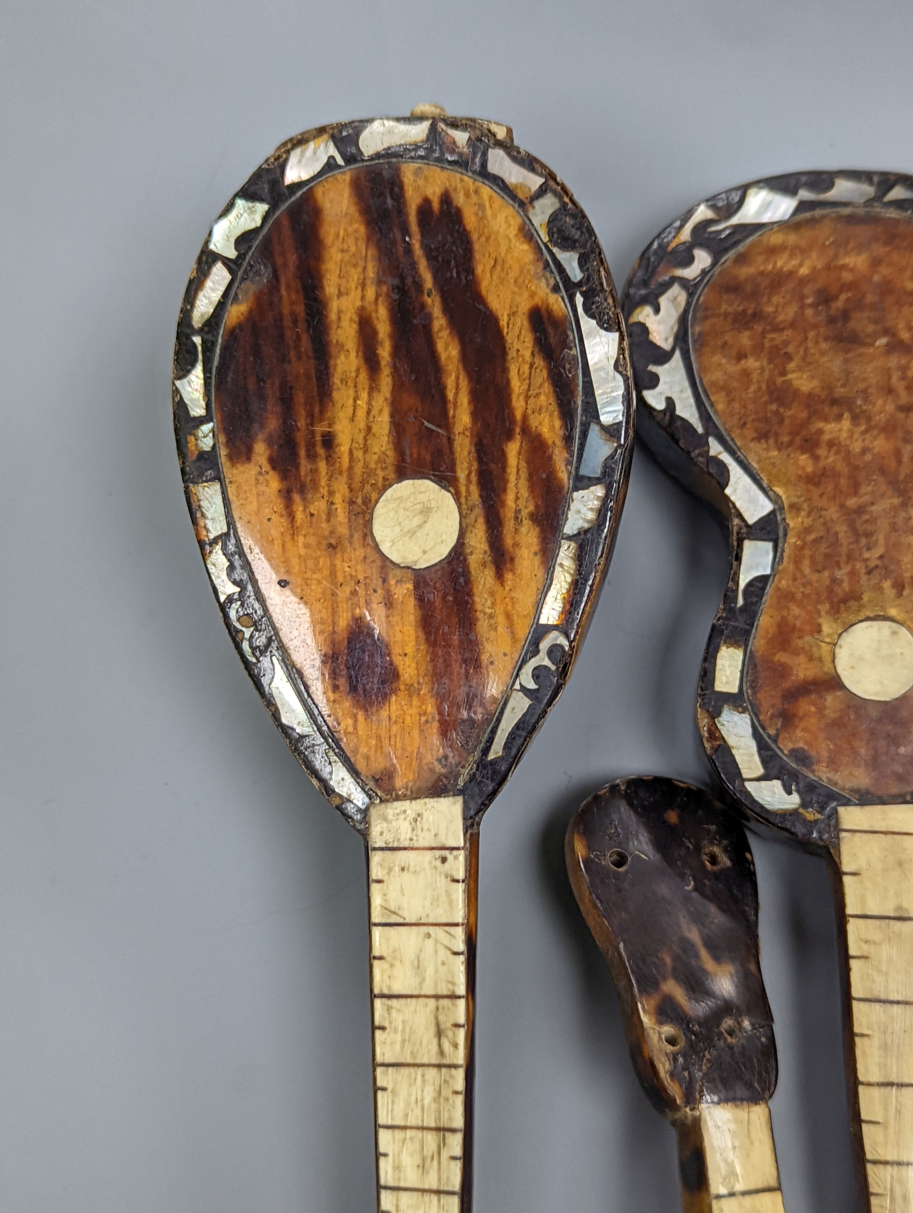 Five 19th century tortoiseshell miniature stringed instruments, longest 20cm.